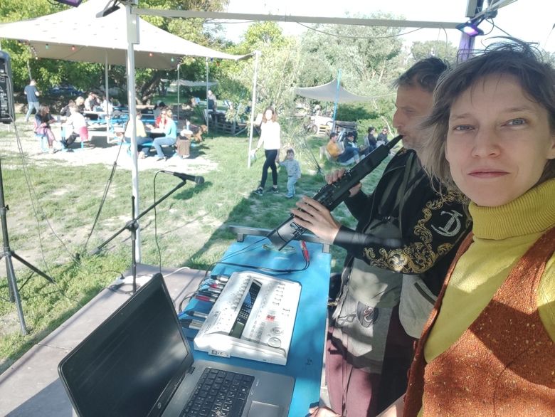 Luca Aza and János Vázsonyi on stage, selfie with laptop and wind controller